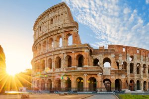 Panoramic view of Colosseum in Rome and morning sun, Italy, Europe.